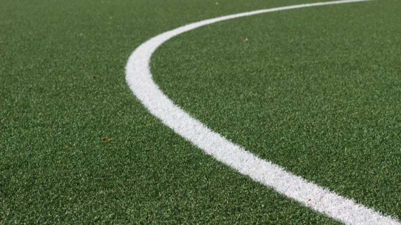 Artifical pitch with curved white line