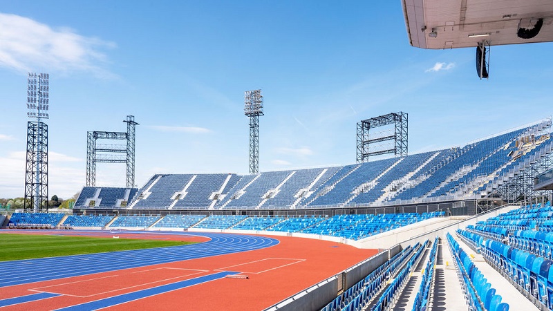 Athletics track with banked seating alongside